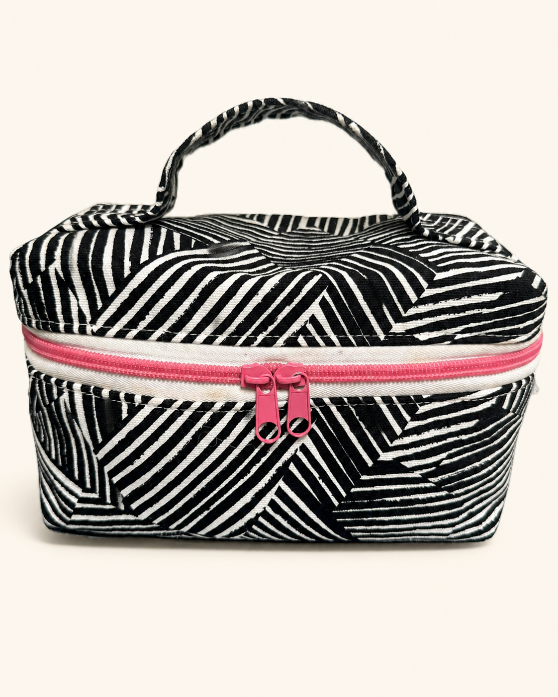 Zebra Double Zip black-and-white striped bag with pink zipper pulls